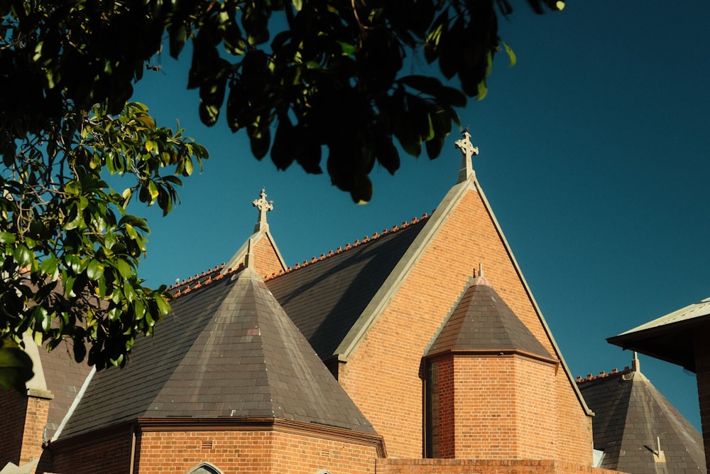 a brick building with a cross on top