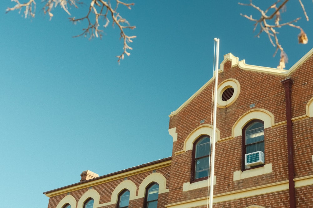 a brick building with a blue sky