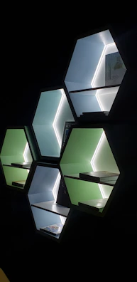 Custom modular shelving unit with glassmorphism panels and soft shadows, styled with elegant decor pieces.