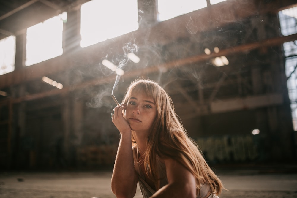 a woman holding a light bulb