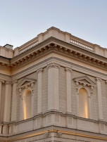 Elegant building facade clad with durable stone panels under natural light.