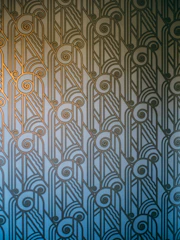 Elegant printed marketing materials with blue and gold geometric patterns.