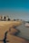 a beach with buildings in the background