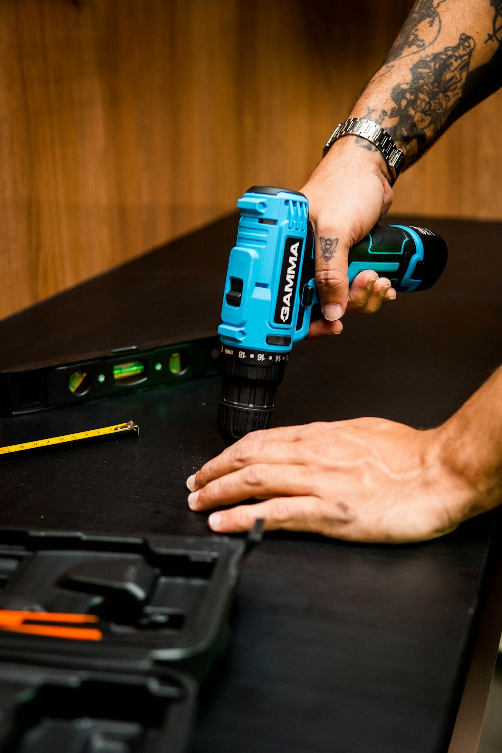 a person holding a blue device