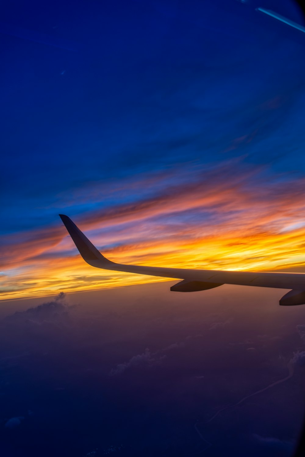 an airplane wing in the sky