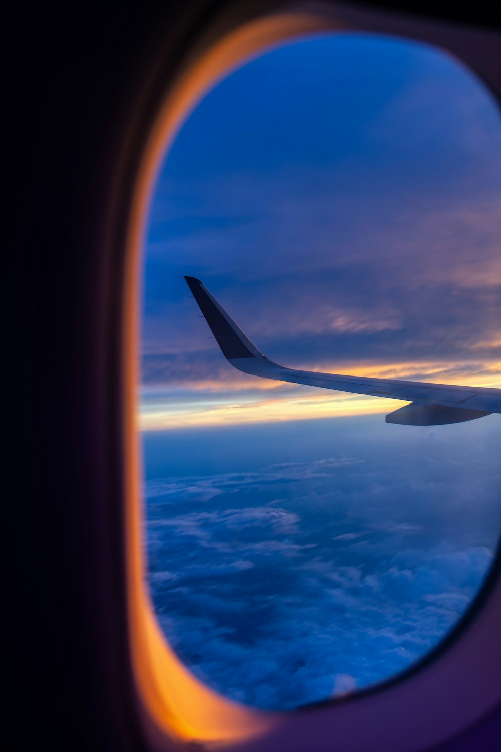 an airplane wing in the sky