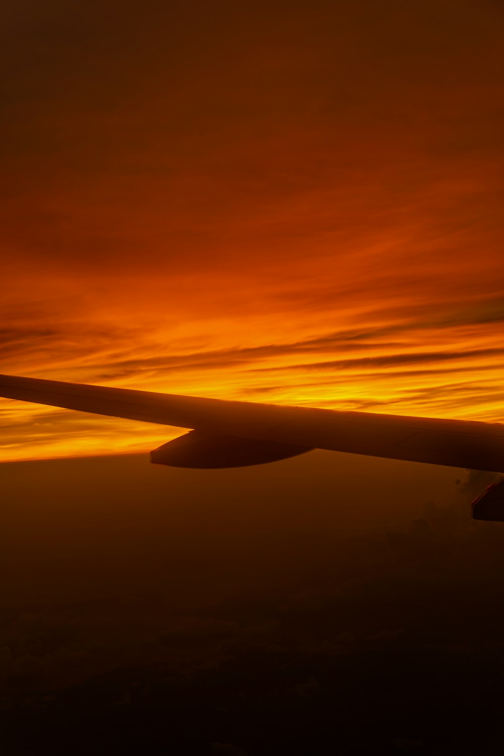 an airplane wing in the sky