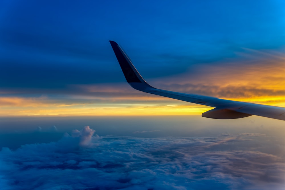 an airplane wing in the sky