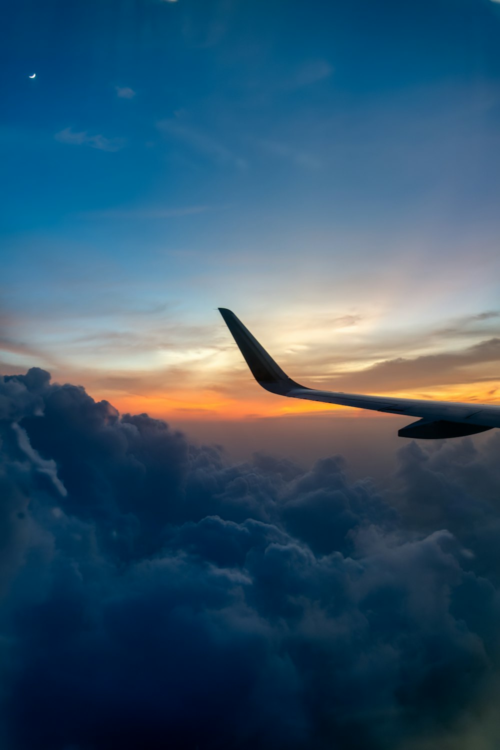 an airplane wing in the sky