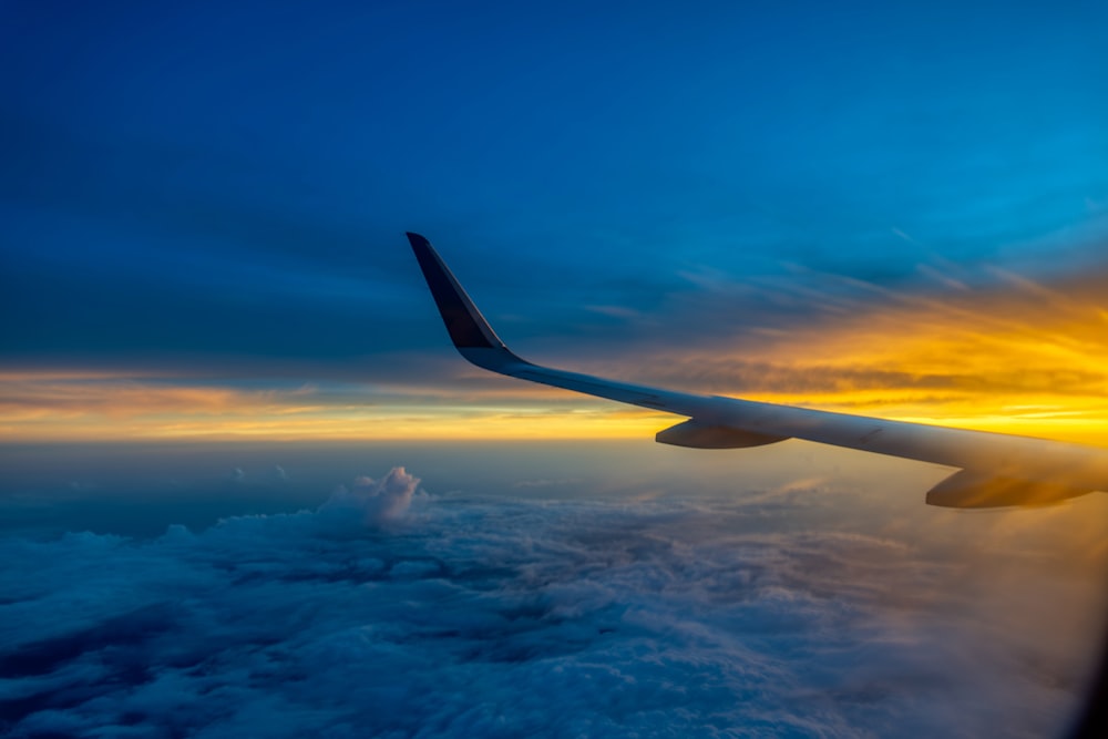 an airplane wing in the sky