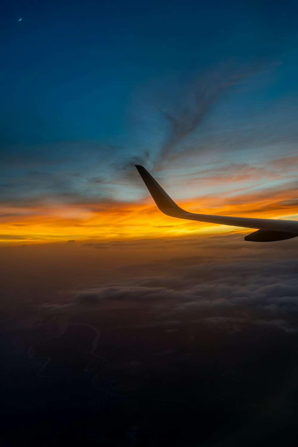 an airplane wing in the sky