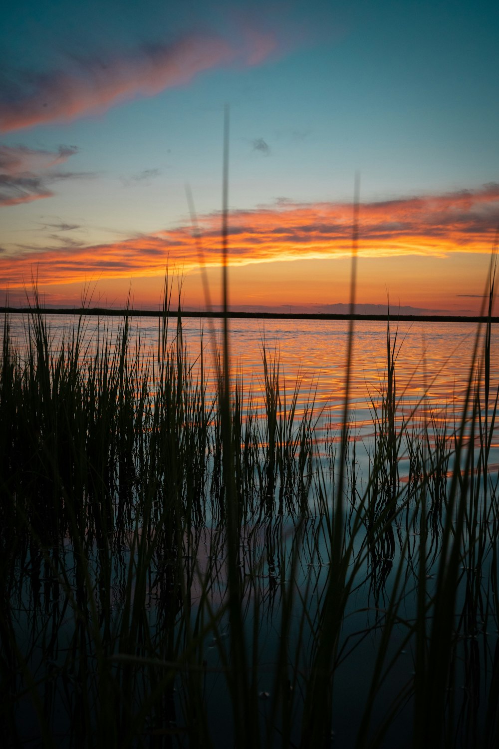 a sunset over a body of water