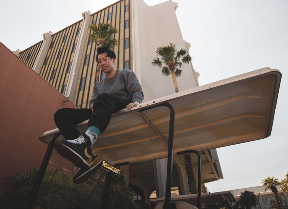 a man riding a skateboard down a railing