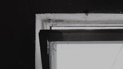 Close-up of cabin window frame components laid out neatly