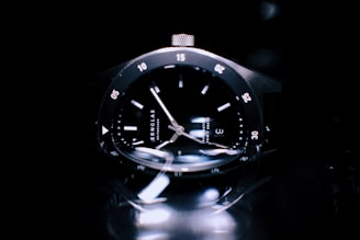 Clock and watch glasses reflecting light, highlighting their flawless finish and durability.