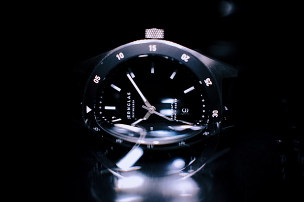 Clock and watch glasses reflecting light, highlighting their flawless finish and durability.