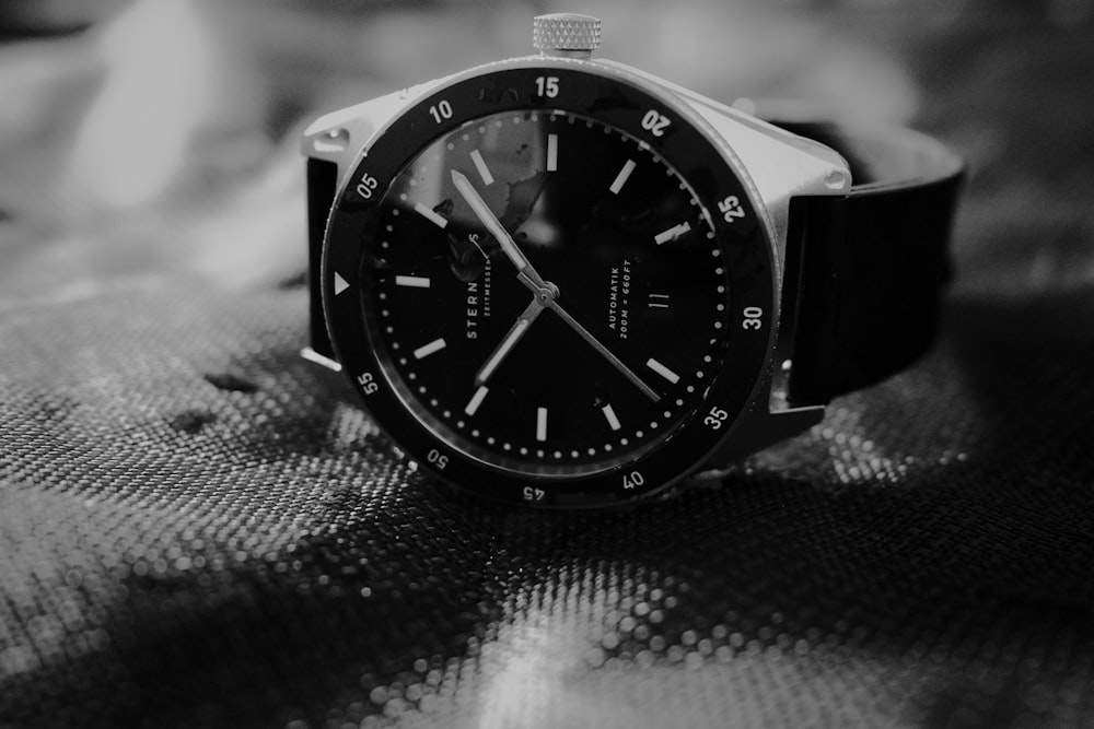 a black watch on a person's wrist