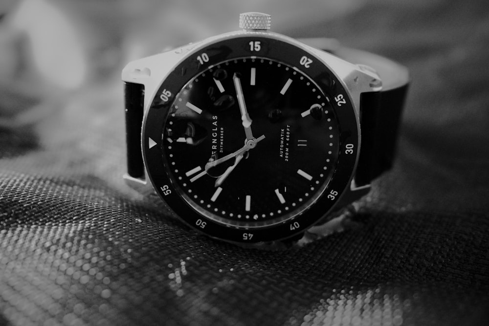 a black watch on a black surface