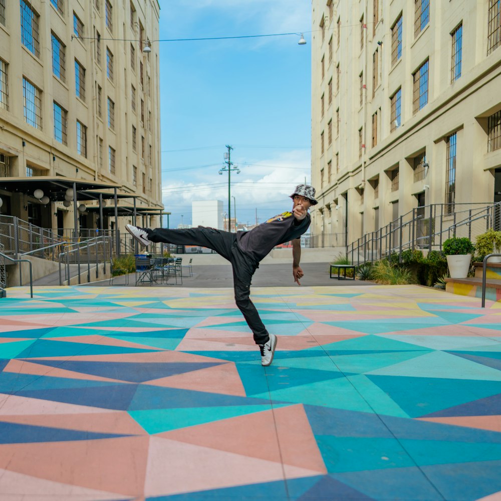 a person jumping on a colorful floor