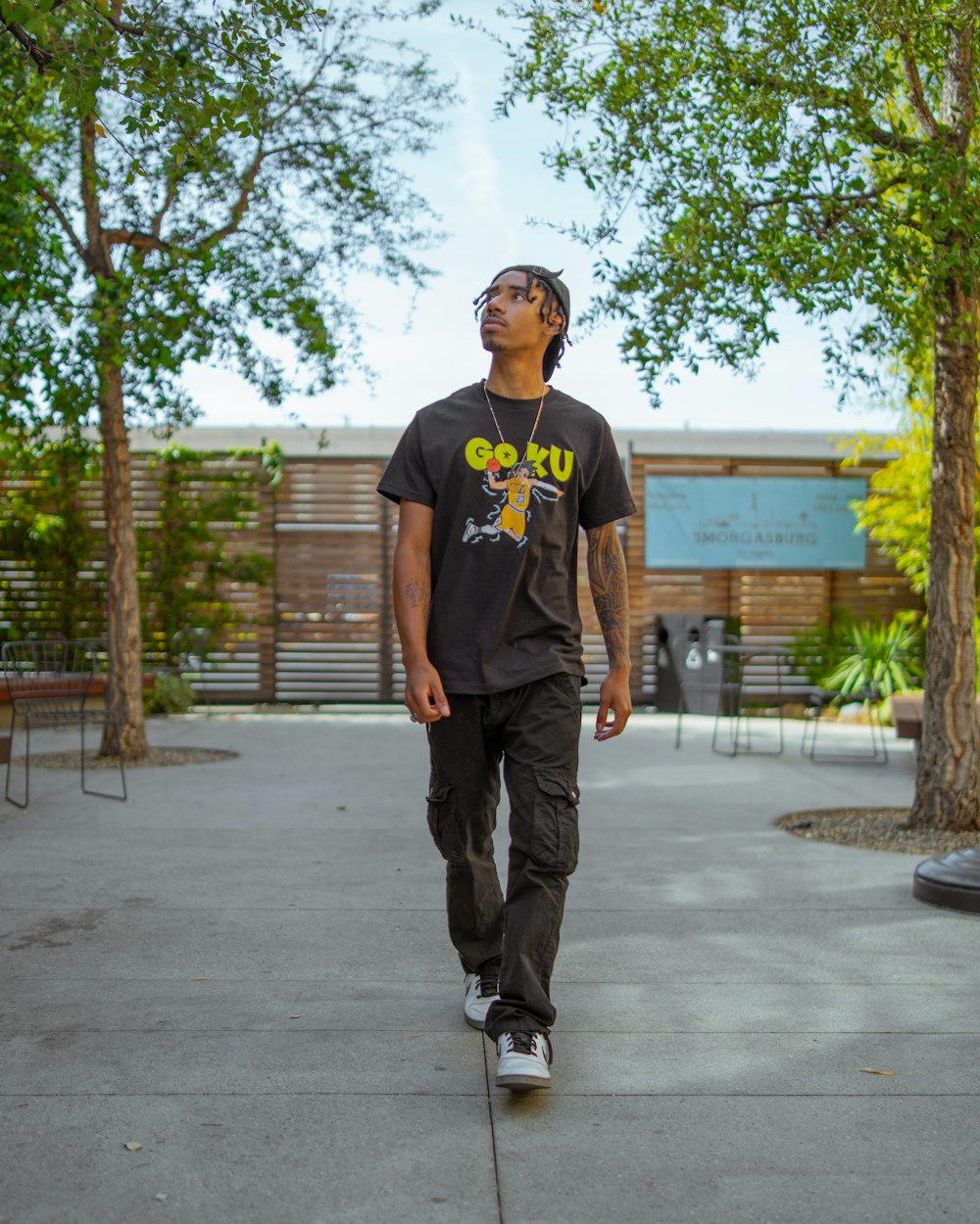 a man wearing a hat and skateboarding