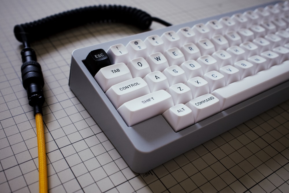 a white keyboard with a cord