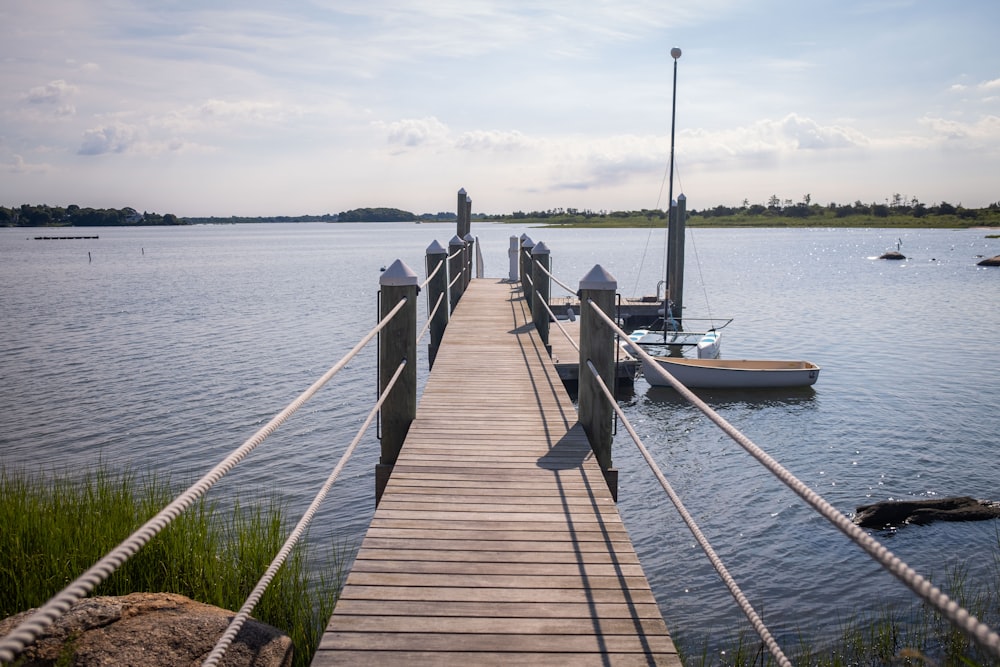 a dock leading to a boat in the water
