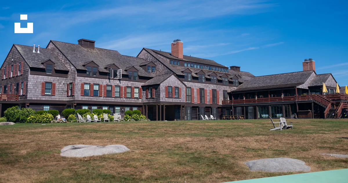 A large house with a lawn in front of it photo – Free Weekapaug inn ...