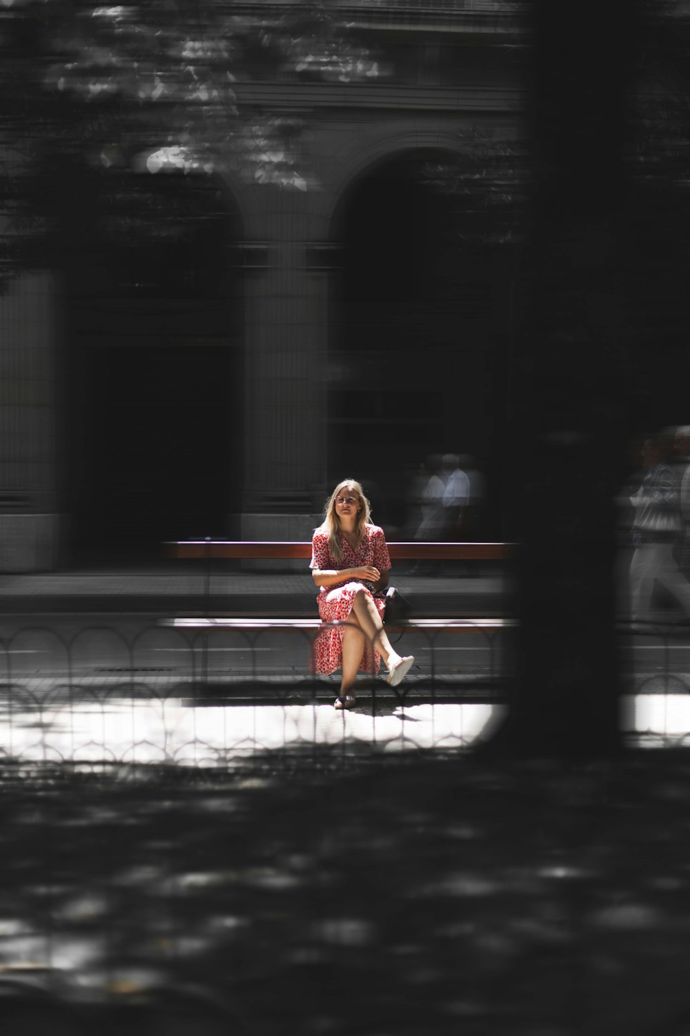 a woman sitting on a bench