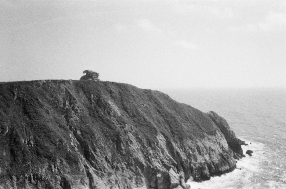 a cliff with a house on it