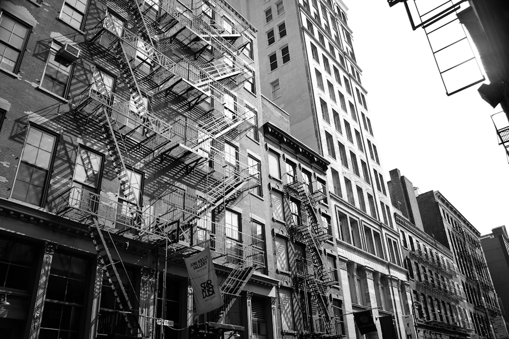 a building with balconies and a sign on the side