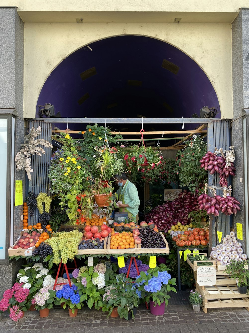 a person selling fruits at a market