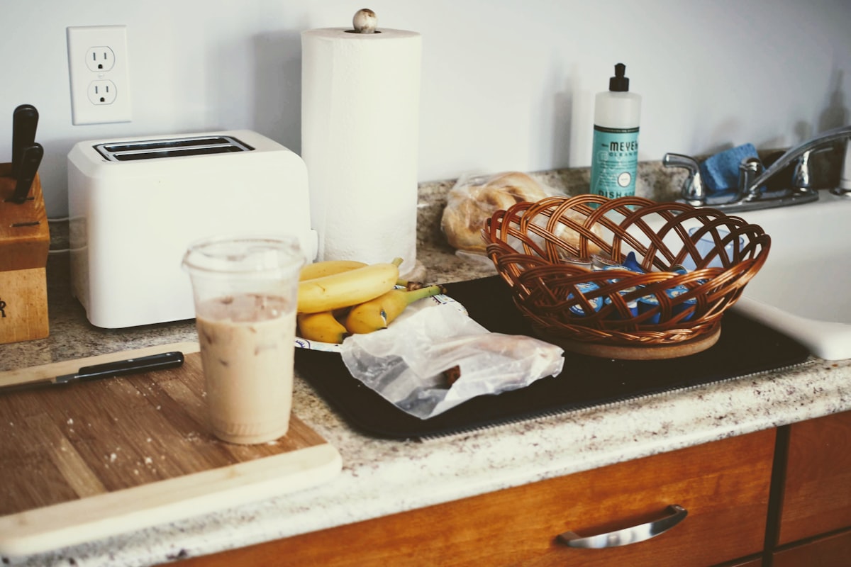 Minimalist kitchen counter, clear and bare, soft daylight