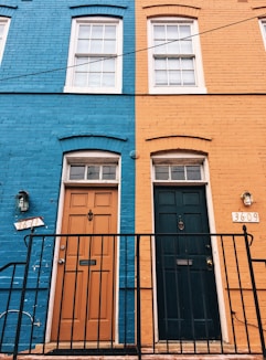 a blue building with a black door