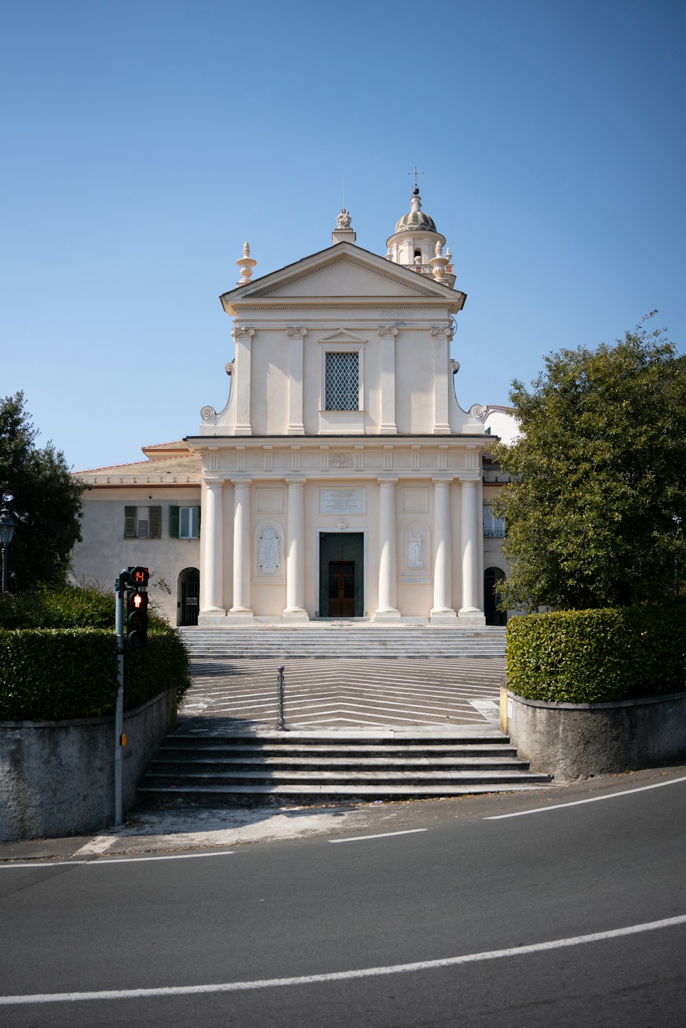 a white building with a cross on top