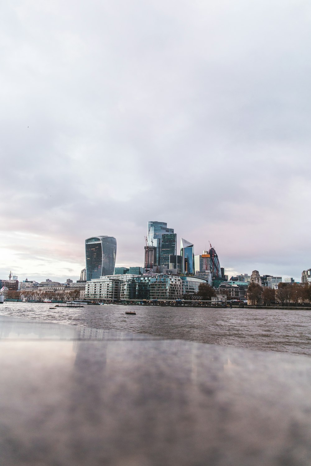 a body of water with buildings in the background