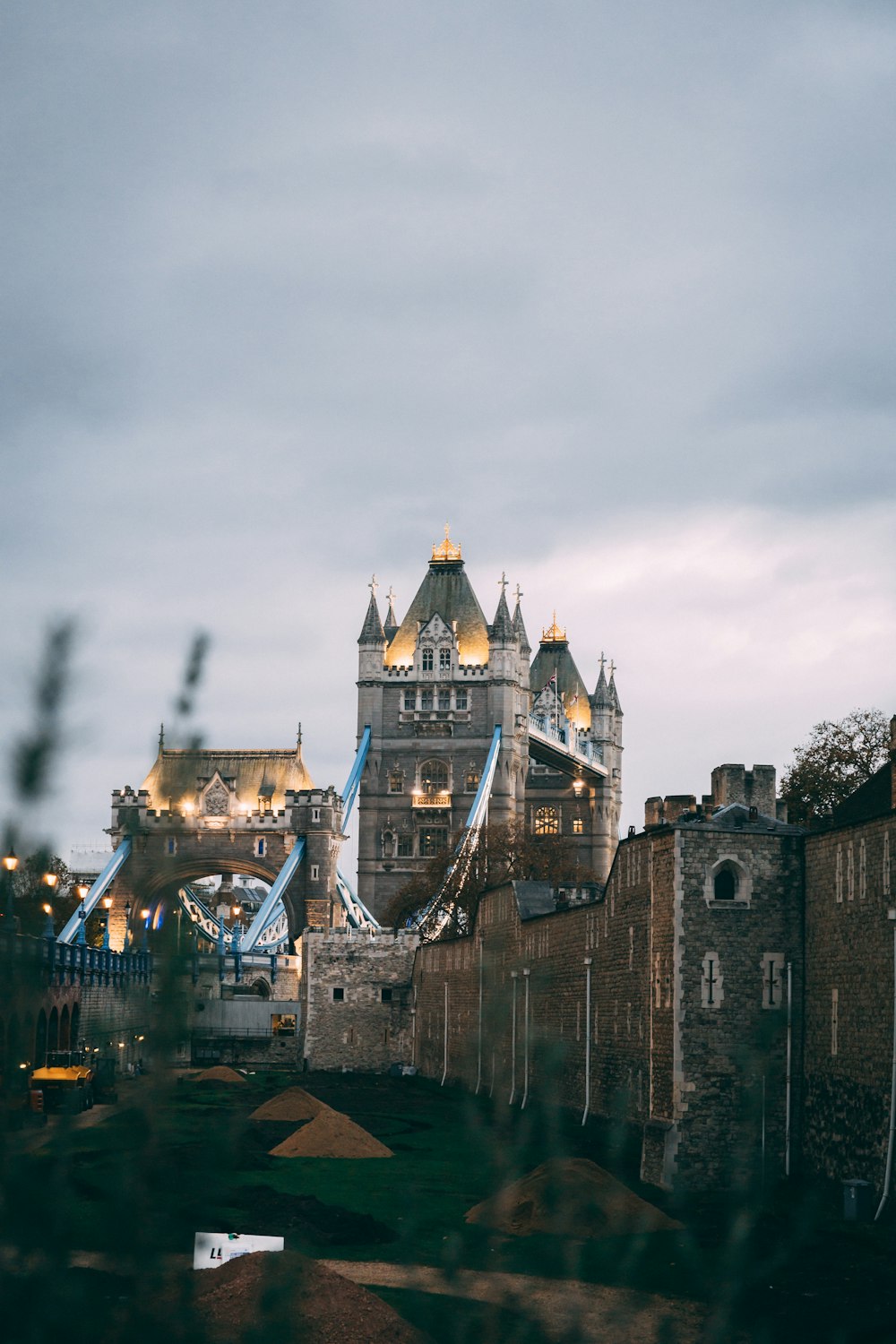 a castle with a bridge and a river