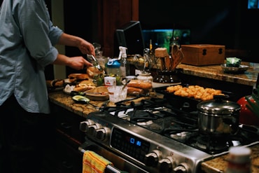 a person cooking food on a stove