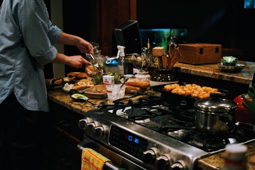 a person cooking food on a stove