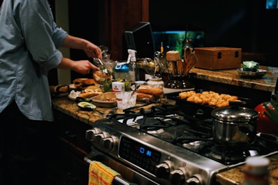 a person cooking food on a stove