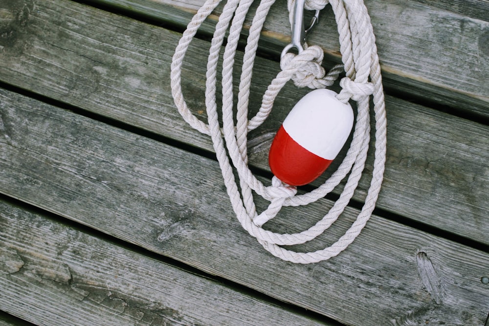 a fishing net with a red ball