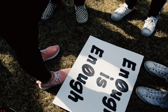 a group of people holding a sign
