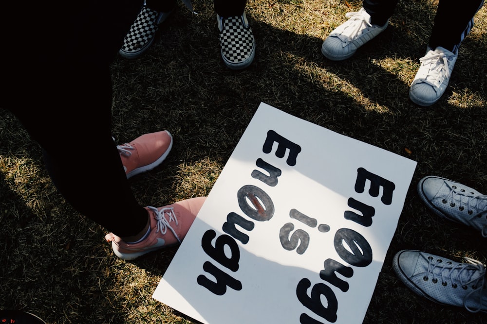 a group of people holding a sign