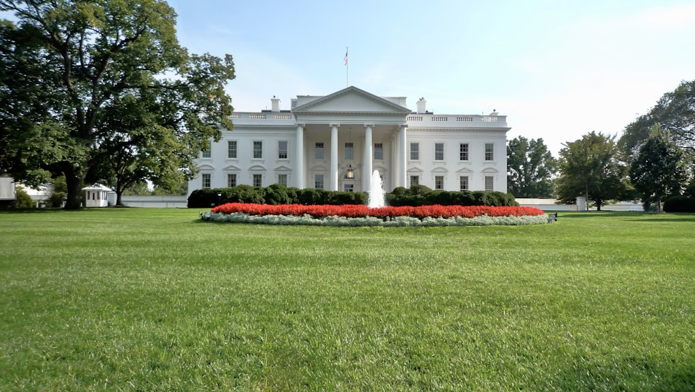 a white house with a lawn in front of it