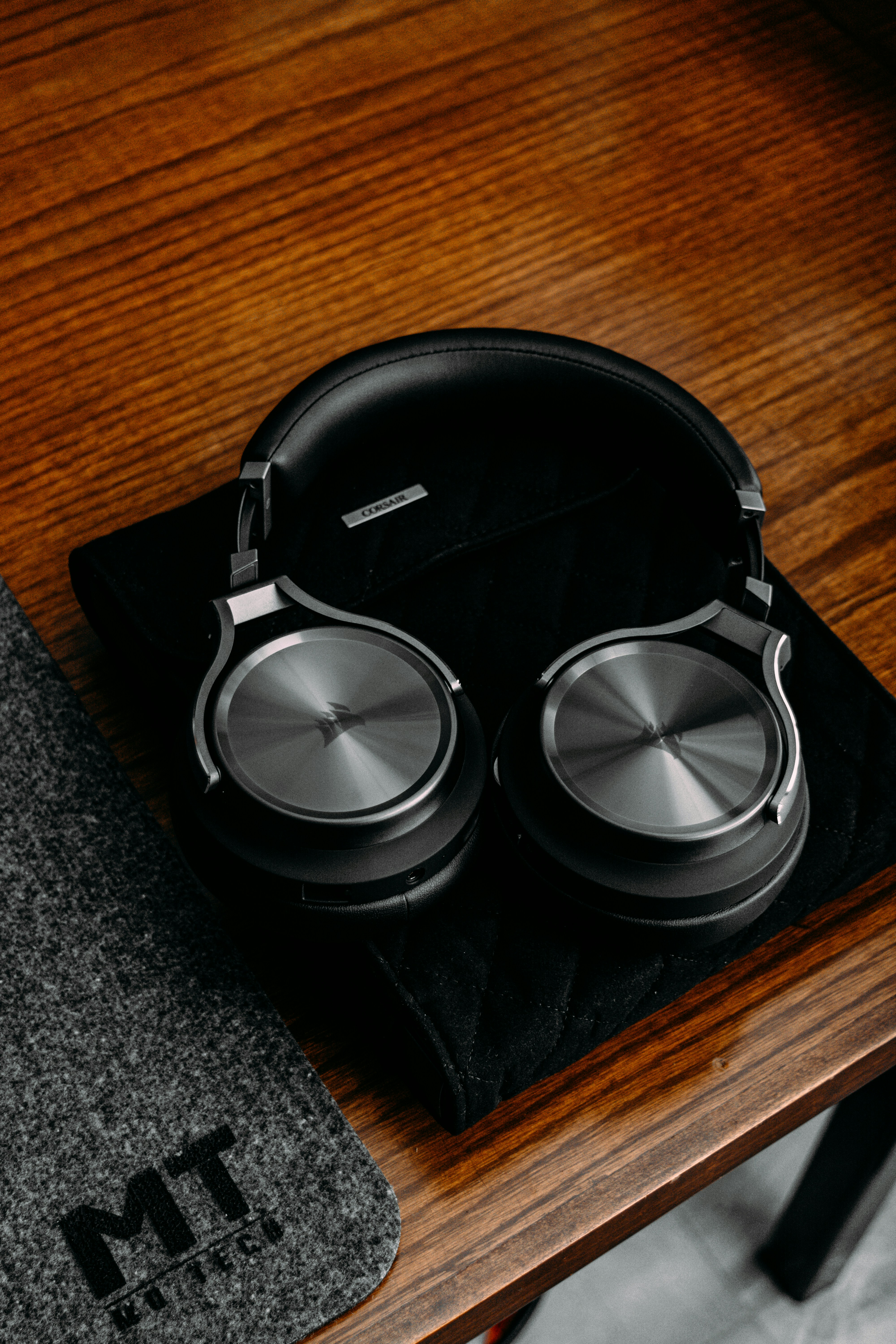 a pair of headphones on a wooden table