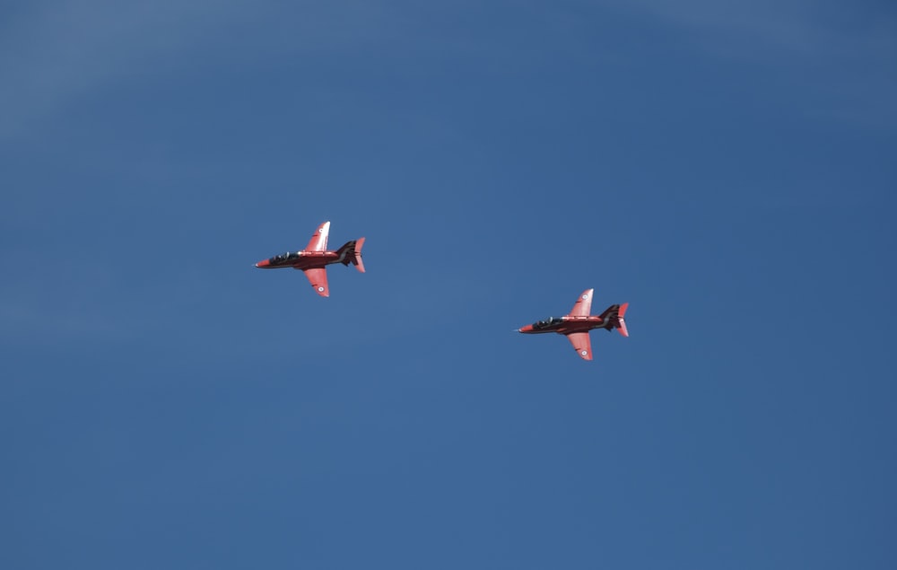 two airplanes flying in the sky