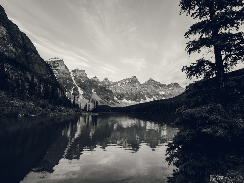 a lake with mountains in the background