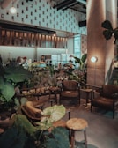 Cozy interior of Cafe Ciel with warm beige and brown tones and friendly baristas behind the counter.