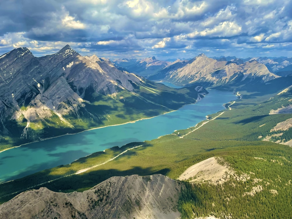 a valley with mountains in the background