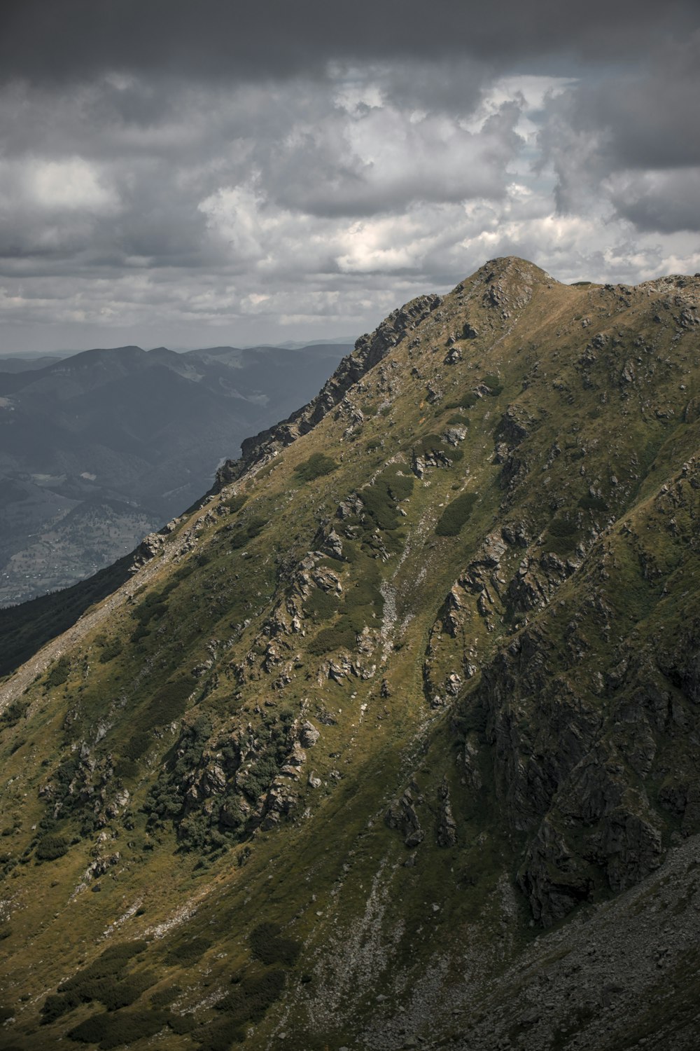 a mountain with a valley below