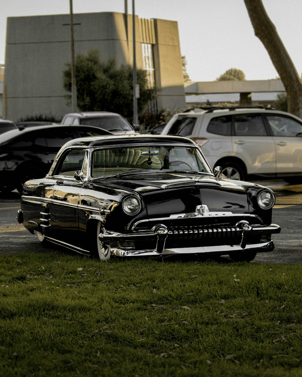 a black car parked in a parking lot